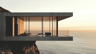 Glass-walled living room at dusk